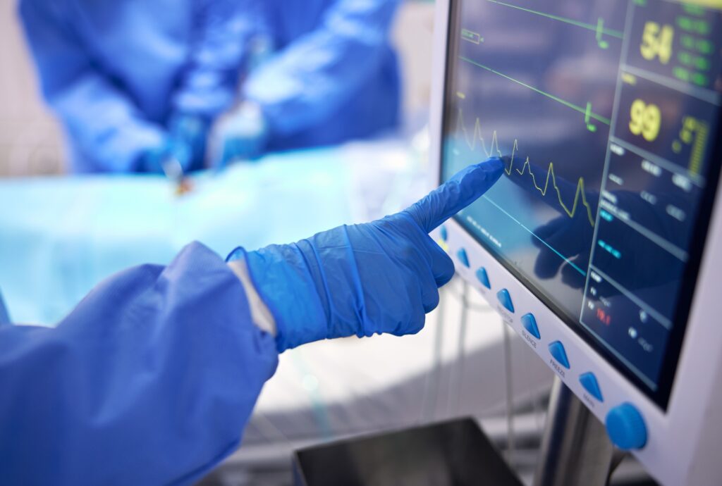 Nurse, monitor and electrocardiogram in surgery, cardiology and check on vitals in operation. Docto